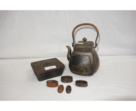 A JAPANESE MEIJI PERIOD BRONZED TEAPOT AND COVER, with raffia type carrying handle, the sides decorated with figures, and a J
