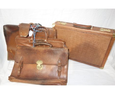  A MODERN ITALIAN BRIEFCASE WITH GOLD COLOURED HARDWARE, with three brown leather vintage suitcases (4)