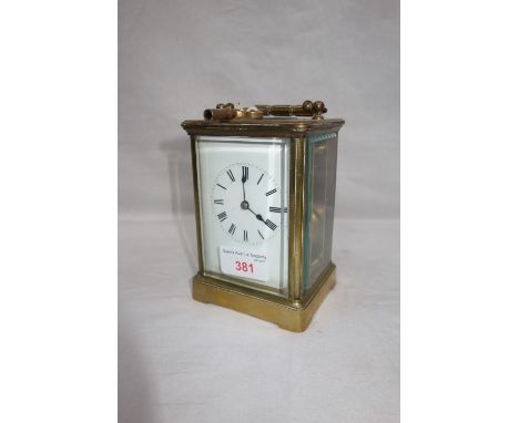 A 19TH CENTURY BRASS CASED FRENCH CARRIAGE CLOCK, visible escapement, white enamel dial with roman numerals (with key), stamp