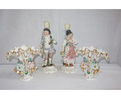 A PAIR OF 19TH CENTURY CONTINENTAL CERAMIC CANDLESTICKS, in the form of a man and woman in traditional dress, and a pair of s