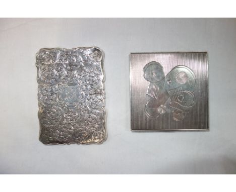 A VICTORIAN SILVER CARD CASE, by Nathaniel Mills, Birmingham 1851, shaped rectangular form, chased foliate decoration, one si