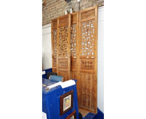 A SET OF FOUR CHINESE ARCHITECTURAL PINE PANELS, late Quing Republic, each panel 226 cm high x 50 cm wide (approx) 