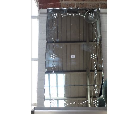 A VINTAGE WALL MIRROR with polished decoration, 98.5 cm high x 50 cm wide