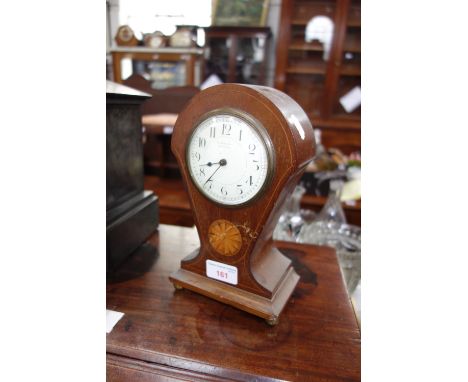AN EDWARDIAN MAHOGANY BALLOON CLOCK with an enamel face, 24 cm high