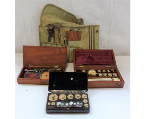 A SET OF SCALES in a fitted box, a set of weights in a bakelite box and a collection of dividers 