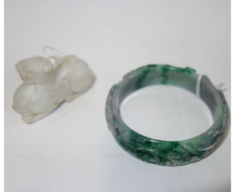 A JADE BRACELET, decorated with a mythical bird between foliage, and a white mythical beast (2)