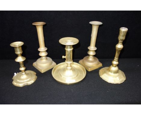 AN EARLY 18TH CENTURY BRASS CANDLESTICK and others similar (5)