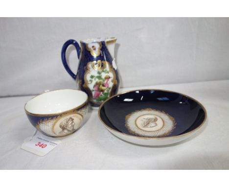 A 19TH CENTURY DRESDEN CABINET CUP AND SAUCER, the central cartouche with a portrait of Apollonius Tyaneus, on a blue ground 