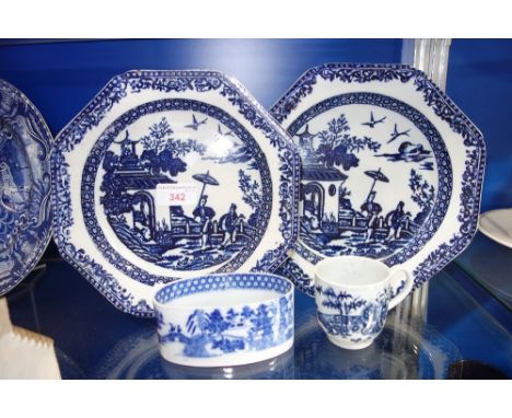 A CAUGHLEY TYPE BLUE AND WHITE TEA CUP, a pair of 18th Century blue and white octagonal dishes and a small blue and white ova
