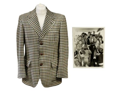 A Daks (Simpson of London) for Andrews of St Albans 100% labs wool check jacket in a mix of green/brown checks on a cream bac