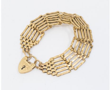 Joan: a 9ct gold gate bracelet, width approx. 20mm, length approx 19.5cm, padlock clasp, weight approx 20gms    CONDITION: Fu