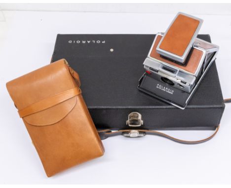 A 1970s cased Polaroid camera with accessory travel case&nbsp; loaned to Eric for his trip abroad by Polaroid UK, camera was 