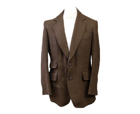 An early 1970s Sports Jacket by Sumrie, with two flap pocket on right side and one flap pocket to other side, wide lapels, on