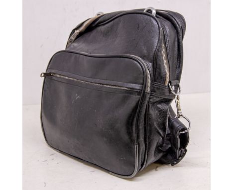 Eric's 1970s flight/travel bag, black in colour, containing some of his personal items - a cased Carl Zeiss camera, sun shade