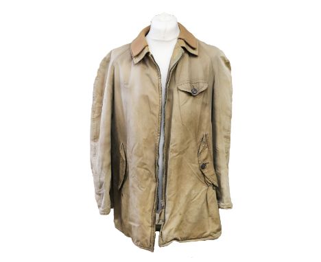 A late 1970s Aquatite waterproof coat in beige, double collar, breast patch pocket, two large slit pockets, button fastening 