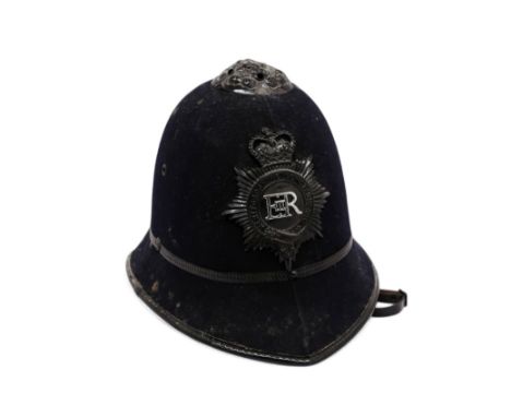 Eric Morecambe's stage props. A police officer's helmet size 53 (6.5)   This lot also include a colour publicity photograph c
