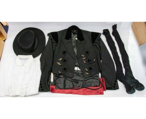 Eric Morecambe's stage props. A Spanish flamenco dancing costume, boxed, comprising jacket, shirt, two cummerbunds, stockings