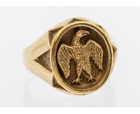 Eric Morecambe's 9ct gold signet ring: oval form with cast depiction of an eagle, with approx 17mm, zig zag detail to mount, 