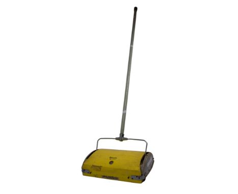 A Retro 1960s Ewbank Regal carpet push to and throw hoover, yellow and grey in colour