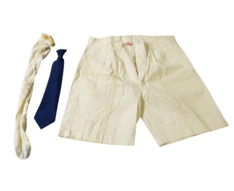 Eric Morecambe's stage props. A blue clip-on tie (wired), one pair of oversized shorts, and one white stocking  ❧ This is fro