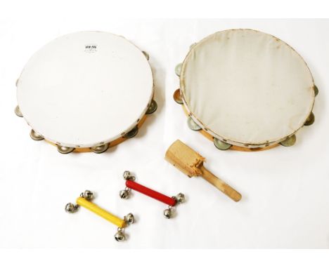 Eric Morecambe's stage props. Two tambourines, two hand-bells, and a castanet clapper  ❧ This is from Eric Morecambe’s privat