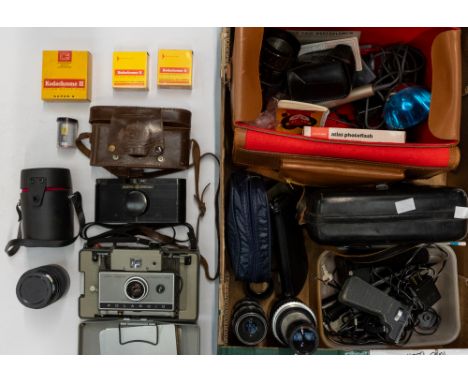 Eric's personal collection of photographic equipment to include a 1950s Purma special cased camera, Polaroid 230, 1960s camer