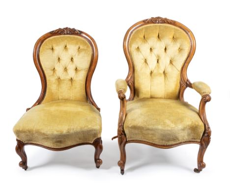 A Victorian mahogany framed balloon back armchair, acanthus leaf to top rail, scroll arm supports above cabriole legs on cast