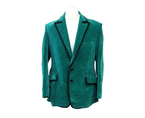 A Jade green velvet Smoking Jacket with black trimming on flap, pockets and lapels with braided trim on perimeter, with cover