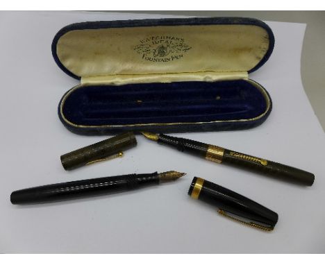 Two Watermans pens, a One Hundred Year pen with 14k gold nib, the other with 14k gold nib and 9ct gold band to the barrel