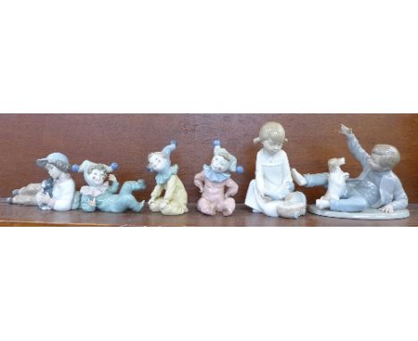 Six Nao figures including three child clown figures
