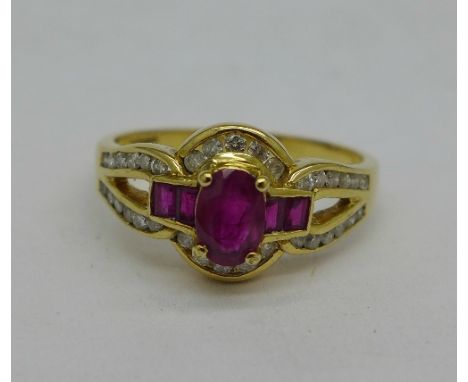 An 18ct gold, ruby and diamond dress ring, 0.3 carat diamond weight, 4.2g, P