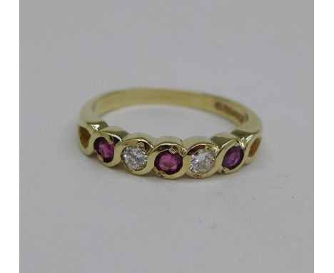 A 9ct gold, ruby and diamond five stone ring, 2.3g, N