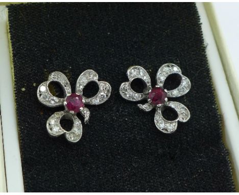 A pair of 18ct white gold, ruby and diamond clover leaf stud earrings