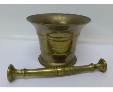 A bronze pestle and mortar