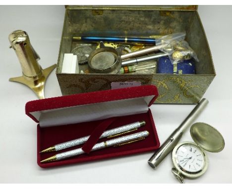 Commemorative crowns, a Ronson table lighter, badges, buttons, pens, etc.