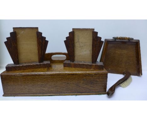 An oak cutlery box, a tray and crumb scoop and a pair of Art Deco wooden picture frames