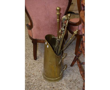 A brass coal shute and fire tools