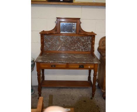 A Victorian marble topped wash stand with mirrored panel to the back