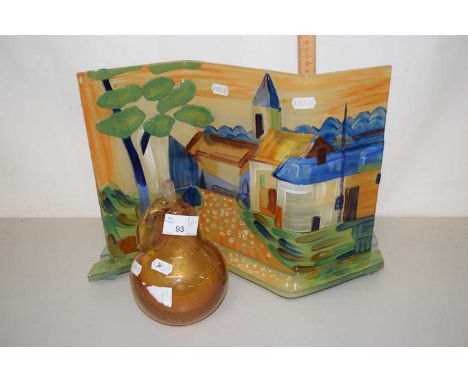 An Art Glass panel decorated with a village street scene together with an Art Glass model of a pear