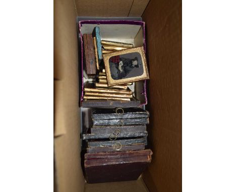 Box containing a collection of Daguerrotypes and other 19th Century portrait photographs, various sizes