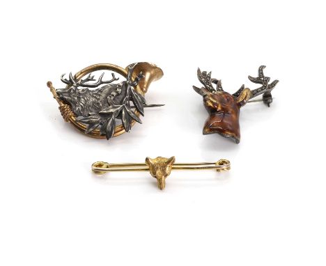 A small group of gold, silver and base metal brooches, comprising a fox mask pin, tested as approximately 9ct gold, a marcasi