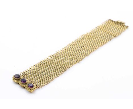 A 19th-century mesh bracelet, possibly pinchbeck; the mesh cuff with plain and reeded chain links, to a filigree clasp accent