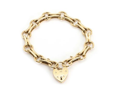 A 9ct gold two row bracelet, with curved and doubled gate links alternating to circular links, to a heart shaped padlock with