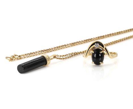 A black coral pendant and a black coral and diamond ring, the coral pendant, 27mm long, stamped 14K 585, suspended by a 9ct g