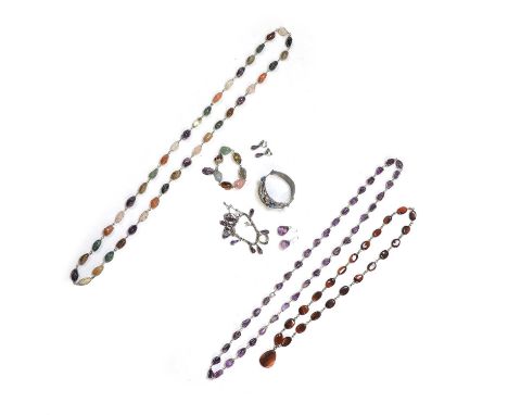 A collection of vintage silver mounted jewellery, comprising a silver paste hinged bangle, a silver amethyst bead necklace, 1