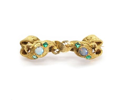 An early Victorian emerald and opal scrolling brooch, with a circular opal cabochon to each side, both flanked by rectangular