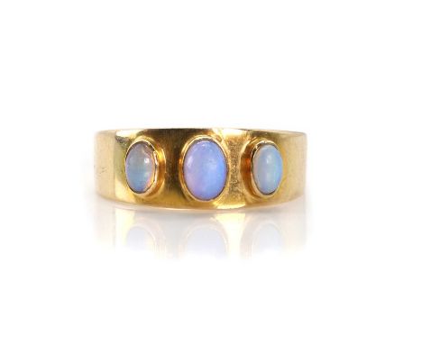 An opal three stone ring,  with three oval cabochon opals, all bezel set to a tapered flat profile mount and shank, stamped 9