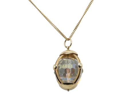 A 9ct gold chain suspending a paste orb pendant, the pendant with a large faceted iridescent paste orb, approximately 20mm di