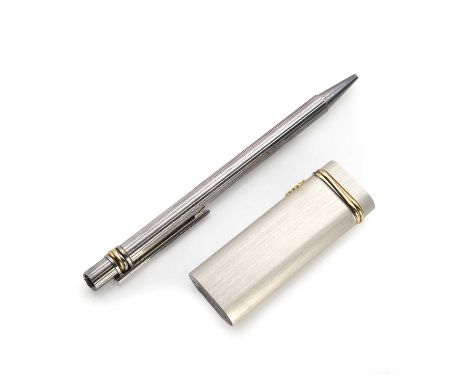 A Cartier Trinity lighter and a Must de Cartier pen, including a ovoid form lighter, with 'Trinity' band to the lid, serial n