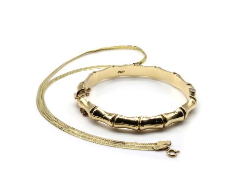 A 9ct gold bangle and a 9ct gold chain, the hollow bamboo style hinged bangle, with a concealed box clasp and safety chain, 6